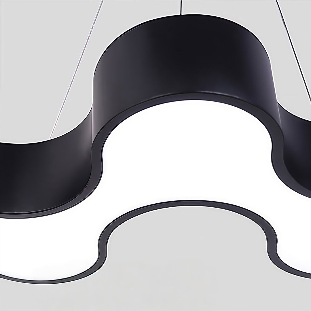 Unique modern chandelier illuminating a modern workspace with elegant light.