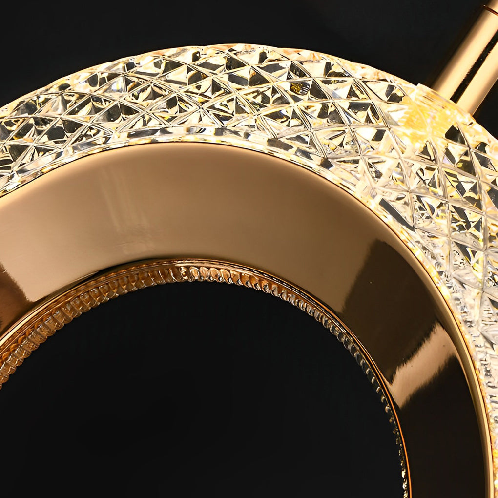 Close-up of crystal edge detail on a unique gold pendant light.