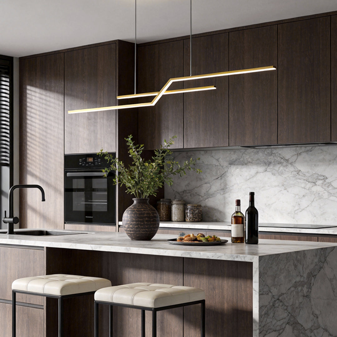 Unique pendant lighting installed above a contemporary kitchen counter, combining sleek lines with warm integrated LED light.