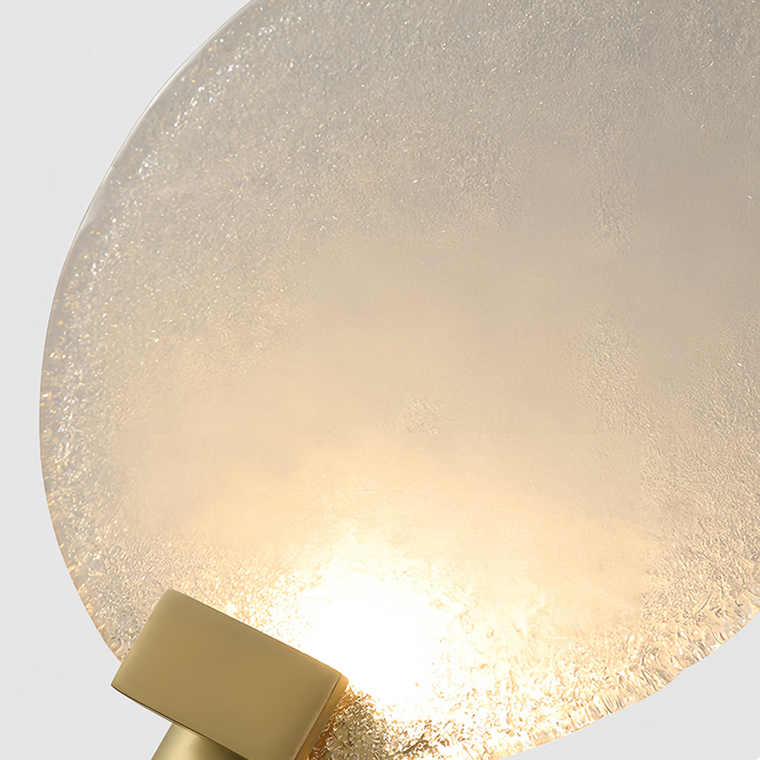 Unique perspective of a round wall light with a frosted glass shade, emphasizing its modern and elegant design.