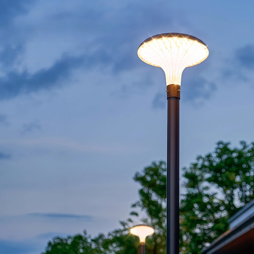 Close-up of a unique street lighting fixture, showcasing its design and illumination.