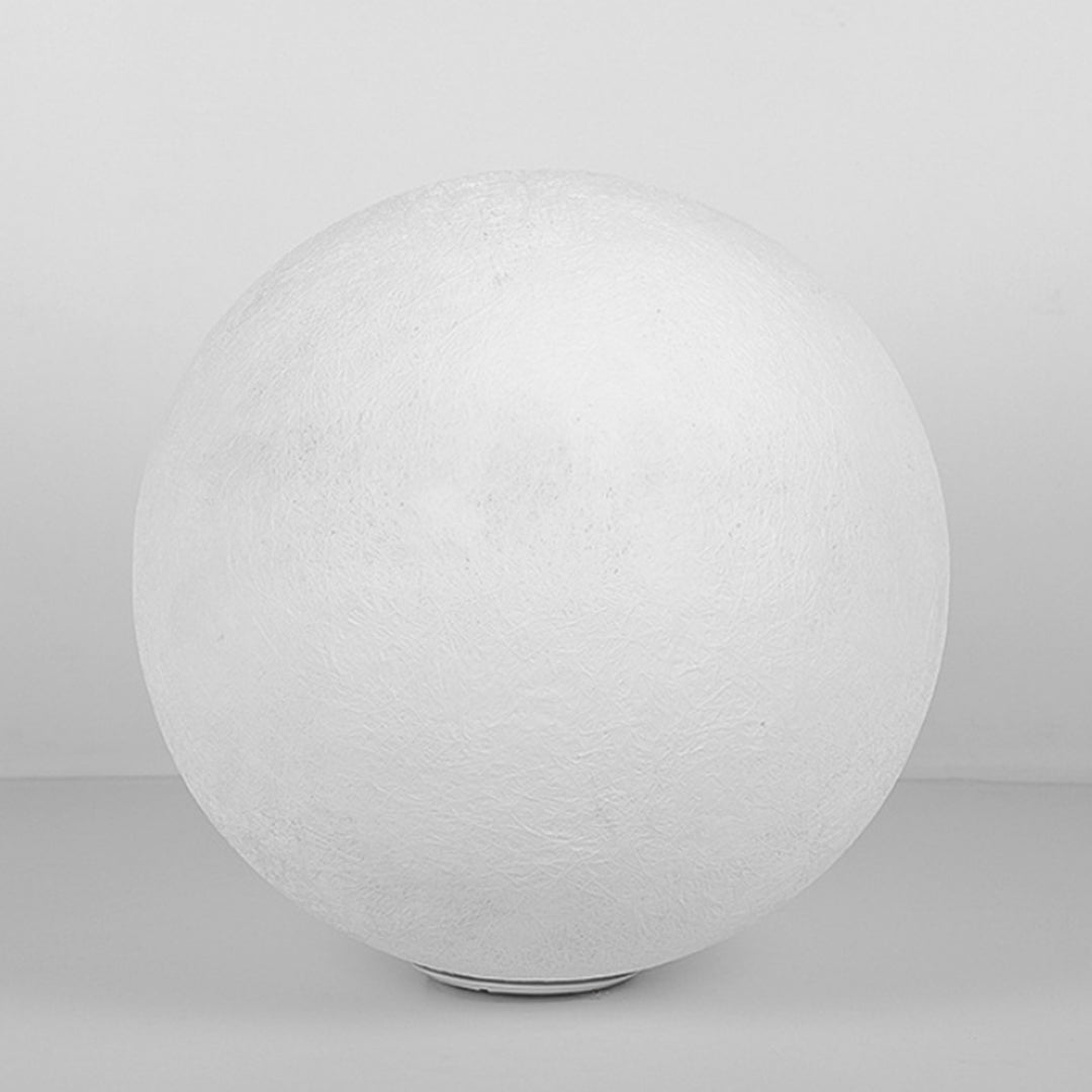 Unlit white spherical outdoor moon lamp isolated on a clean light grey background setting here.