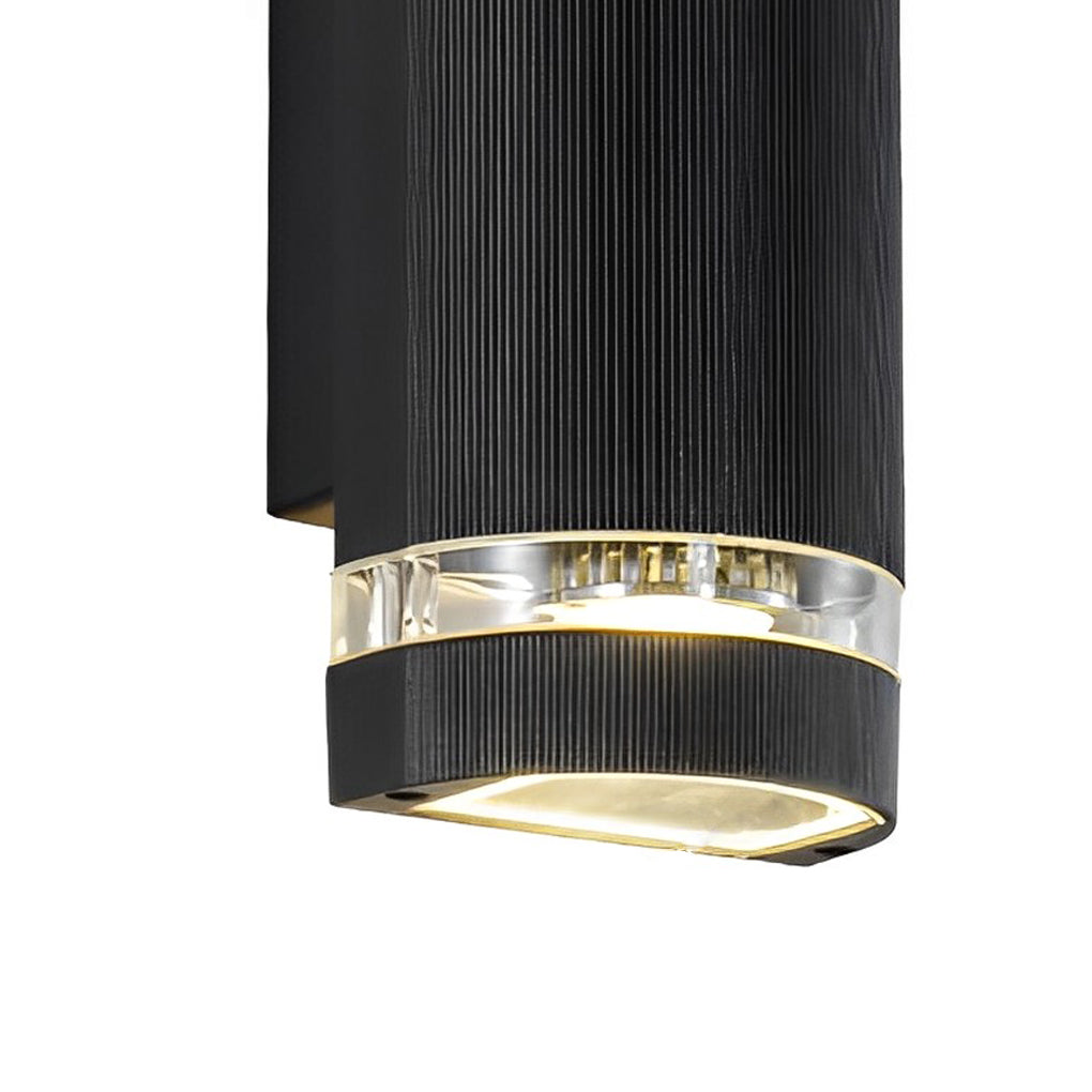 Up and down light wall sconce with black and chrome finish, casting bright light.