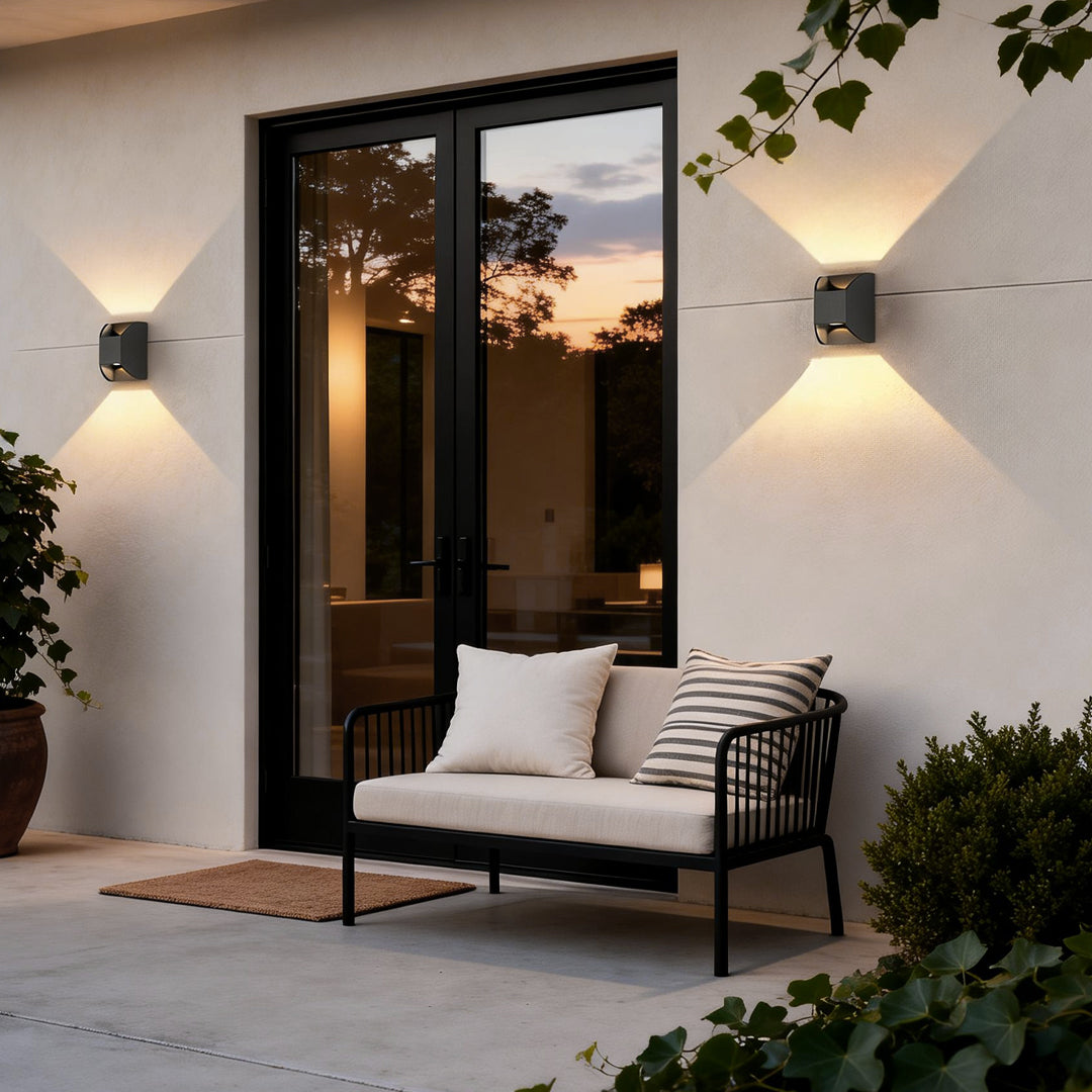 Up and down exterior lights enhancing a contemporary house entrance with elegant ambient light.