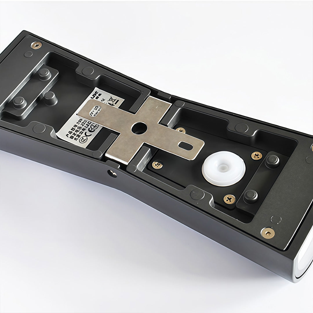 Up and down exterior wall light mounted near glass doors providing architectural accent lighting.