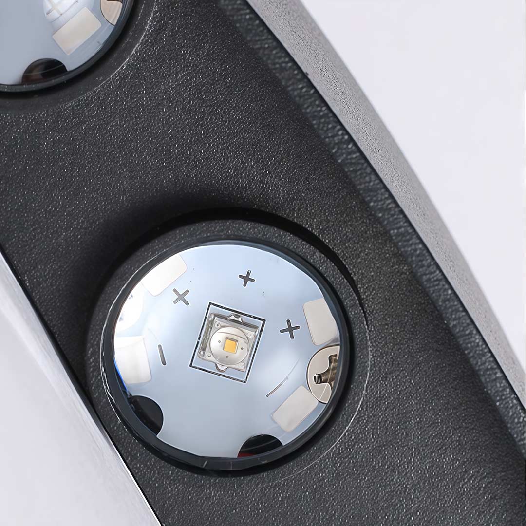Up and down light wall sconce with wavy design enhancing a stylish interior.