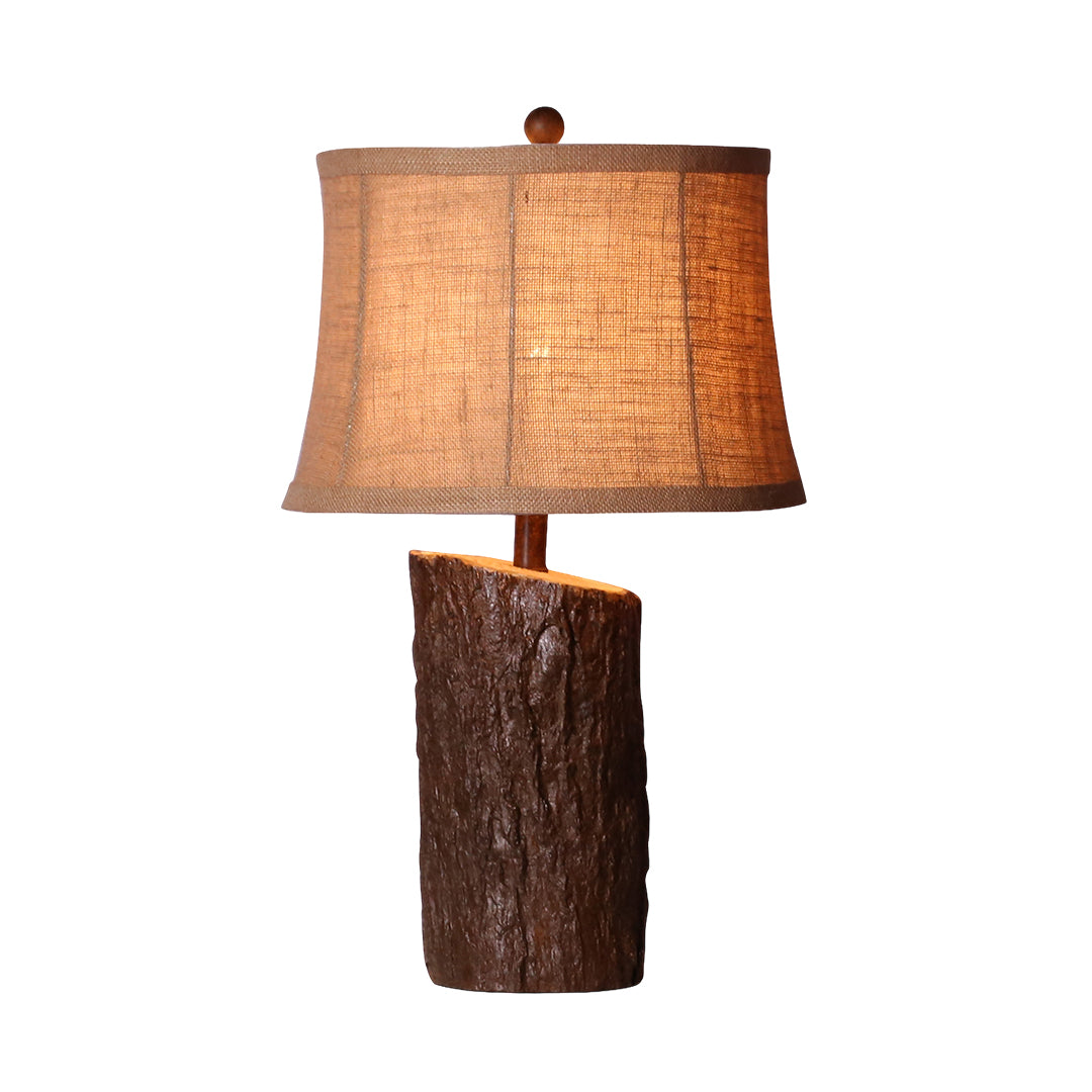 Full height view of the faux wood table lamp, highlighting the upward-angled post connecting the base to the large shade.