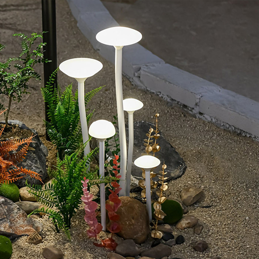 Garden lights landscape installed along concrete walkway creating sophisticated urban landscape lighting design