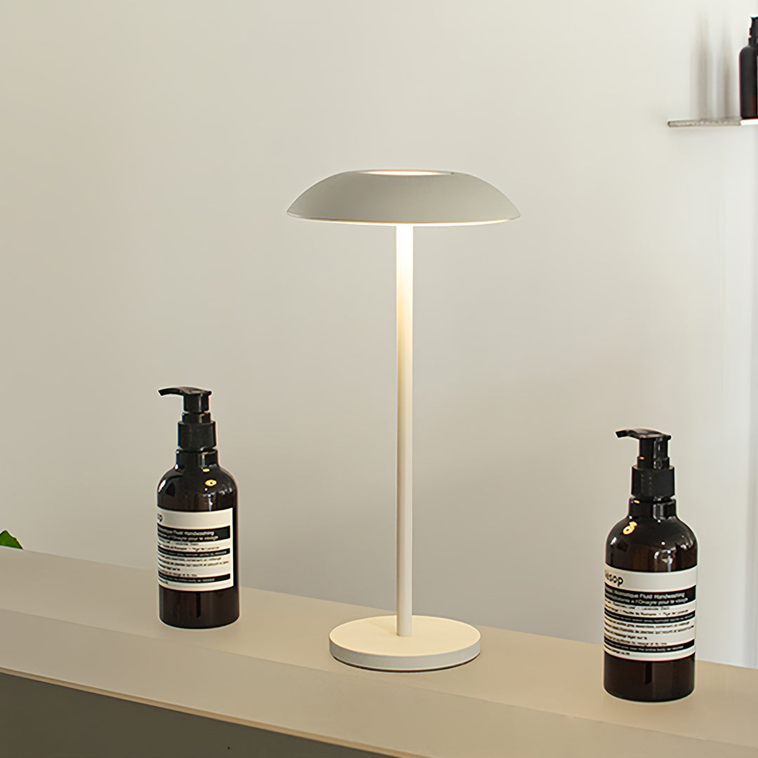 Bathroom vanity setup showcasing small black pendant light in sleek white table lamp form