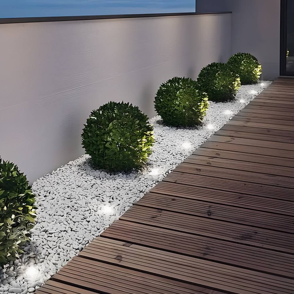 Collection of various sizes of recessed floor lighting fixtures with solar panels for versatile outdoor use.