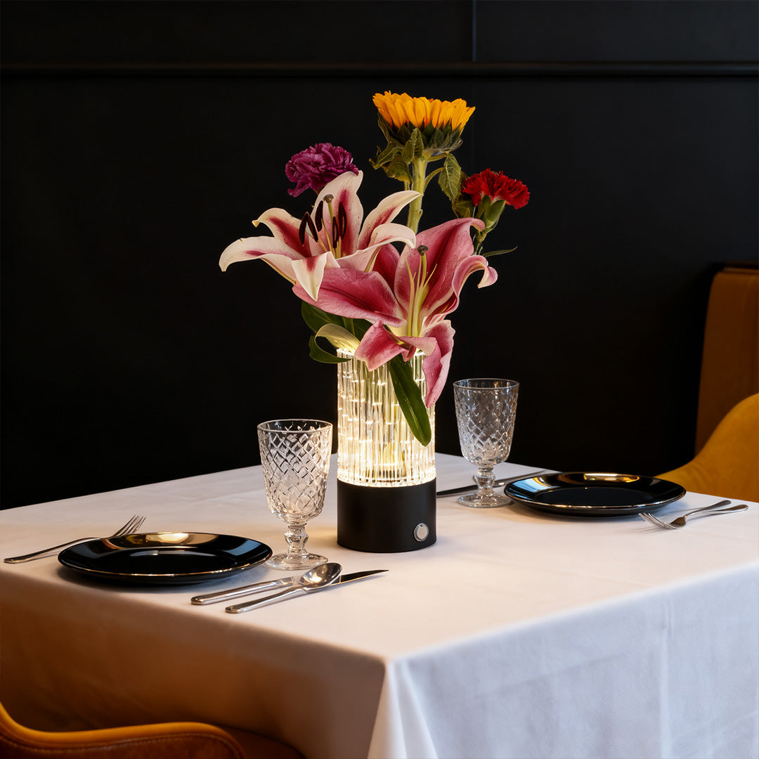 Versatile deco table lamp used as a centerpiece and flower vase on an elegantly set dining table.