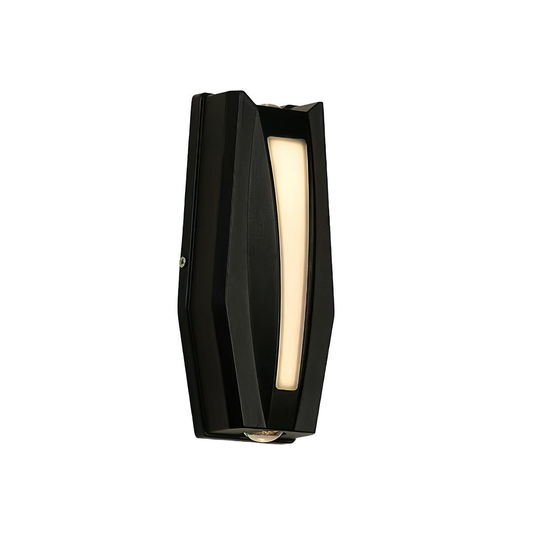 Black vertical up down outdoor wall light featuring textured curves and warm illumination.