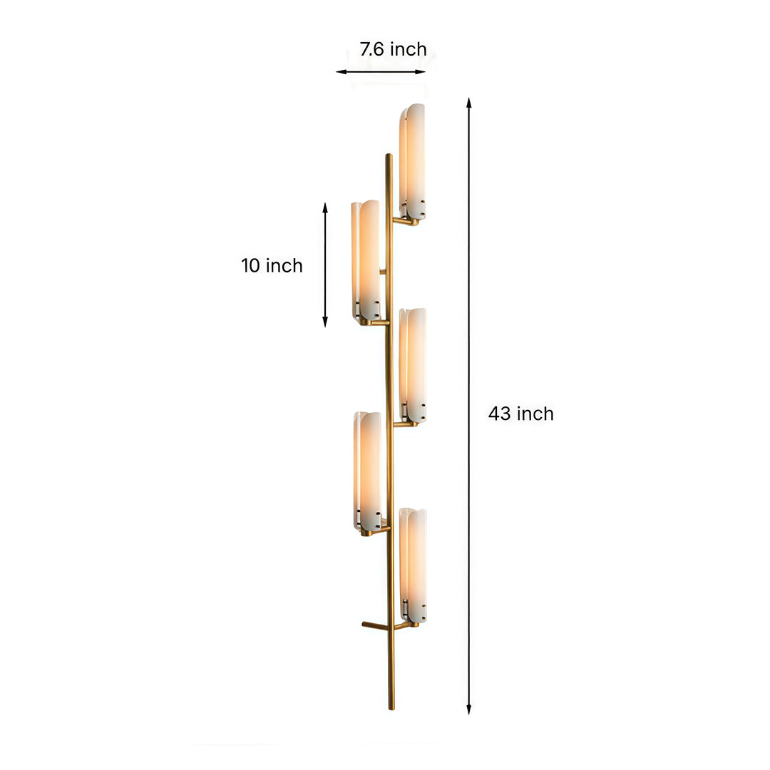 Vertical brass wall light with glass shades featuring three cylindrical frosted glass tubes on elongated backplate.