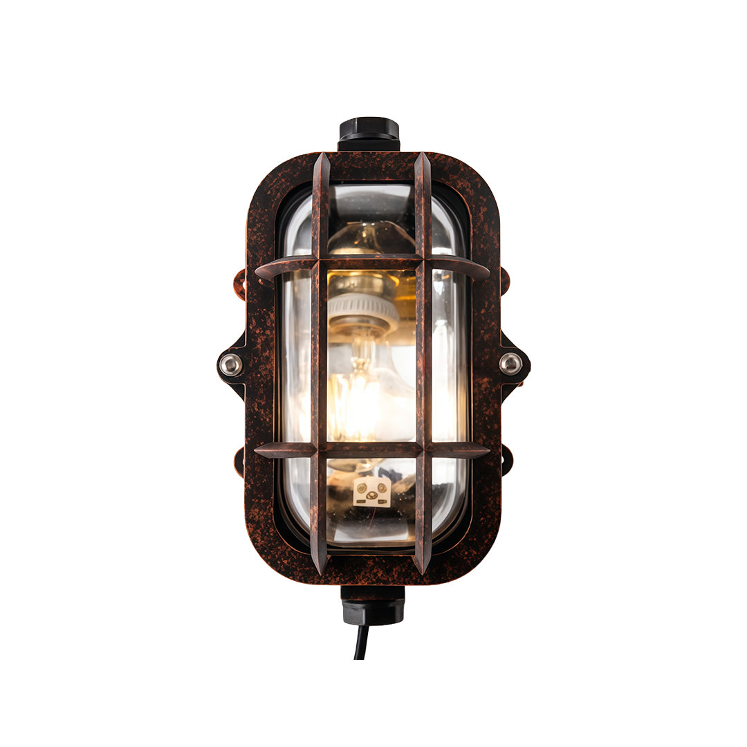 Vertical industrial outdoor sconce with arched cage design and weathered bronze finish metal frame