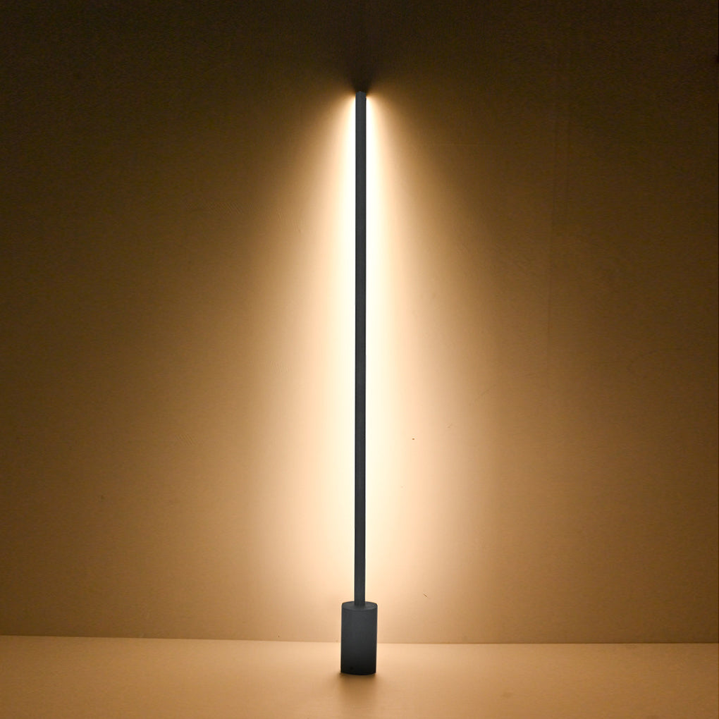 Single vertical LED contemporary outdoor floor lamps showing warm upward and downward illumination effect.