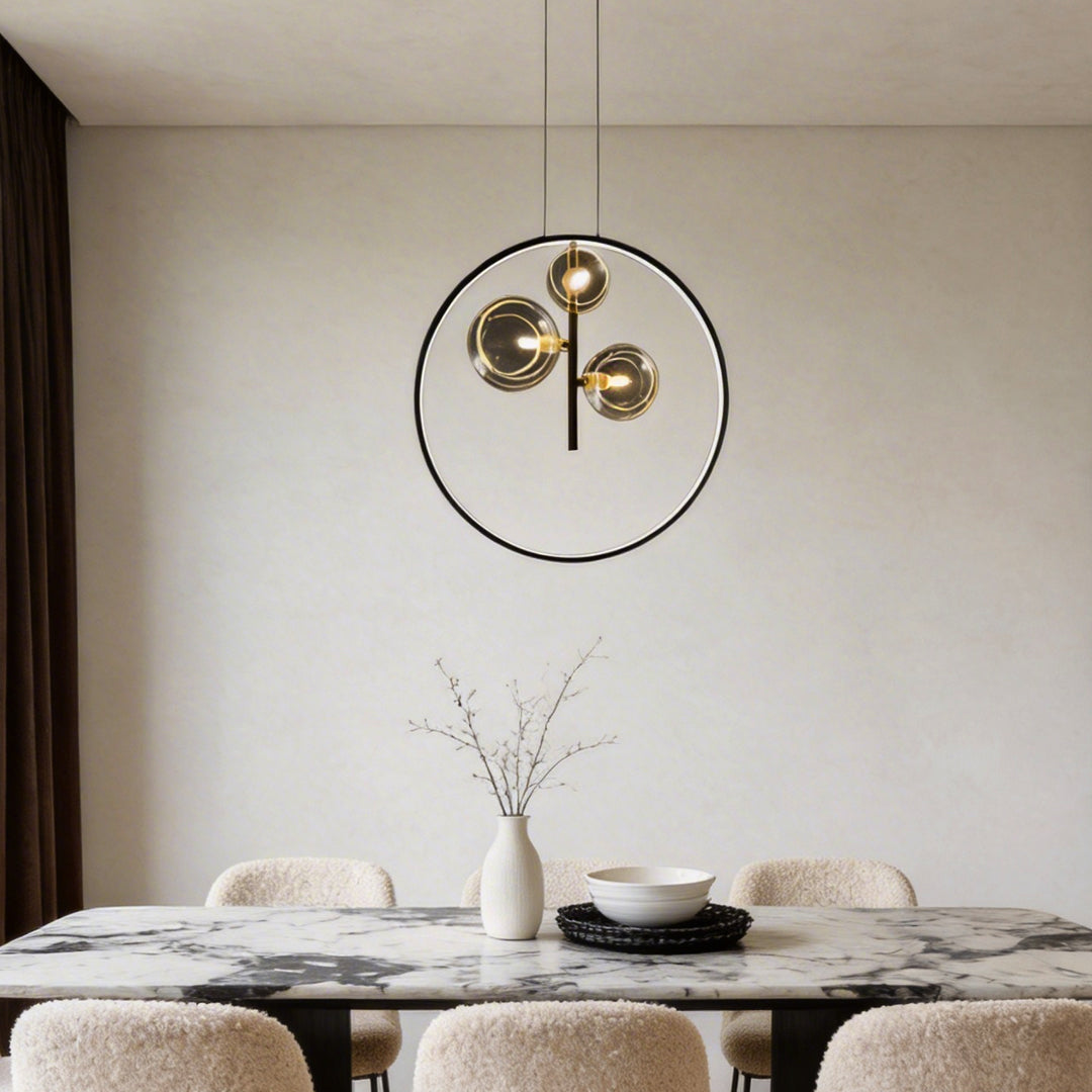 Vertical ring pendant light with a close-up of its minimalist ring and bulb structure.