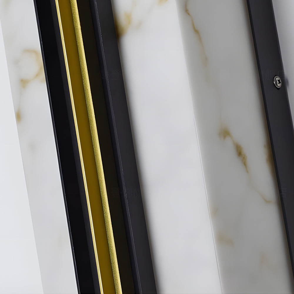 Close-up detail of vertical wall light showing marble glass panel and metal frame construction.