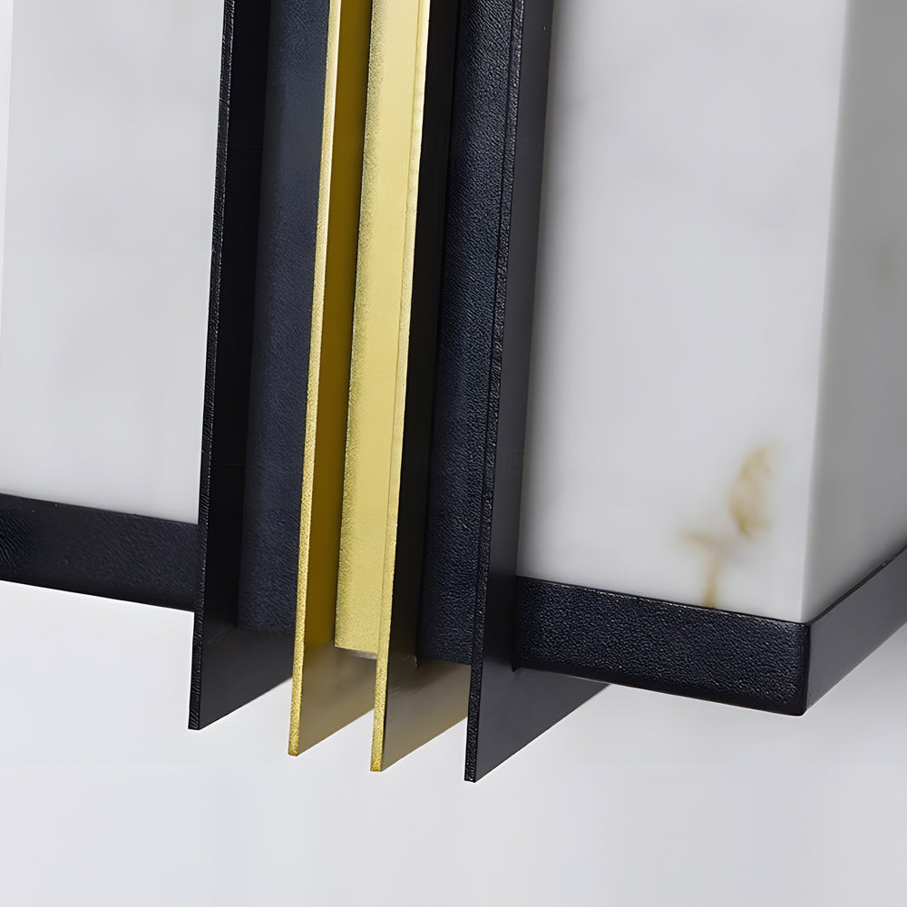Modern vertical wall light metal edge and marble diffuser detail highlighting premium materials.