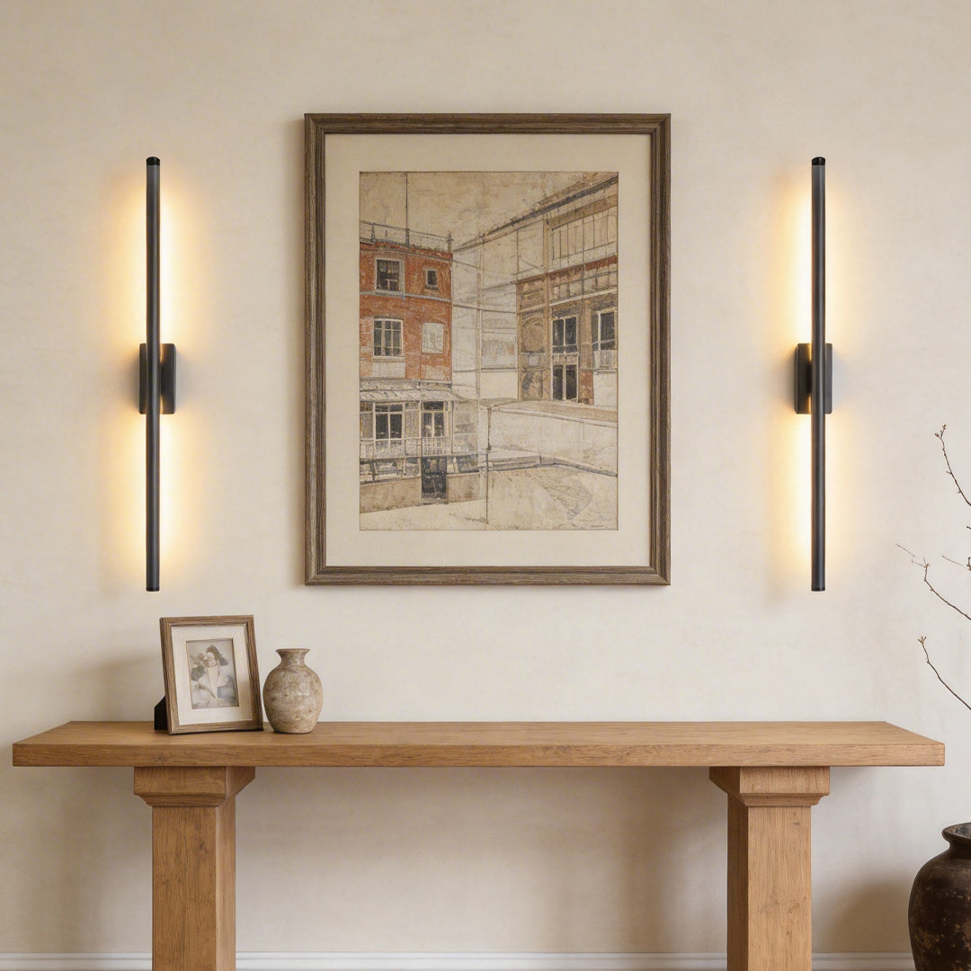 Vertical wall lights enhancing a contemporary console table area with elegant ambient light.