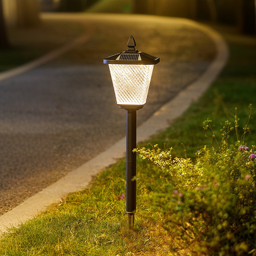 Classic black Victorian-style lamp post with ornate details and white glass shade