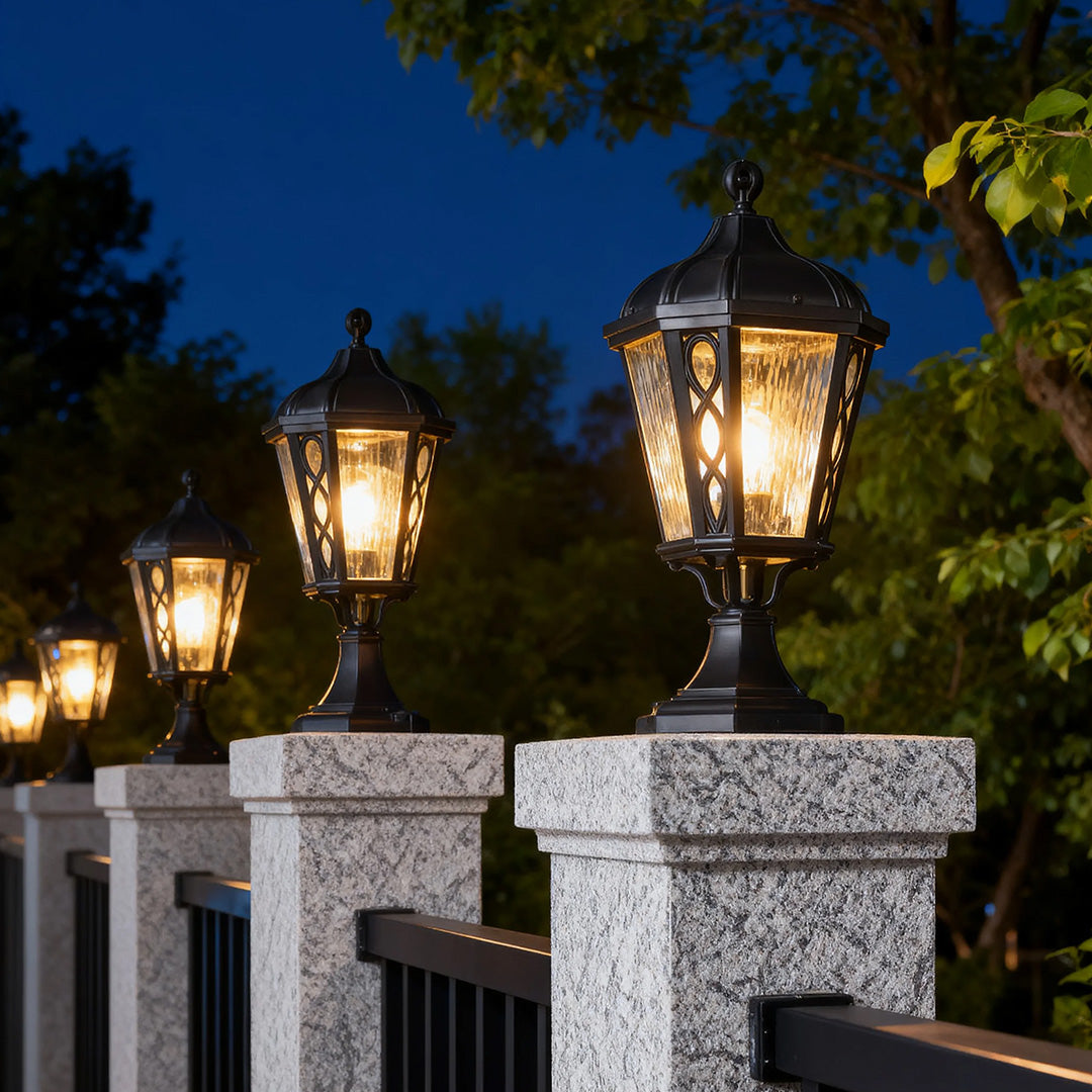 Vintage-style black post light in a garden setting, warm and inviting outdoor lighting