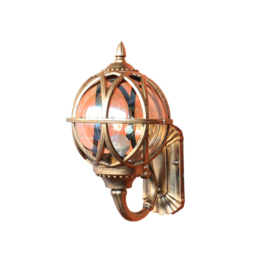 Vintage-style brass spherical lantern with decorative mounting hardware and glass panels