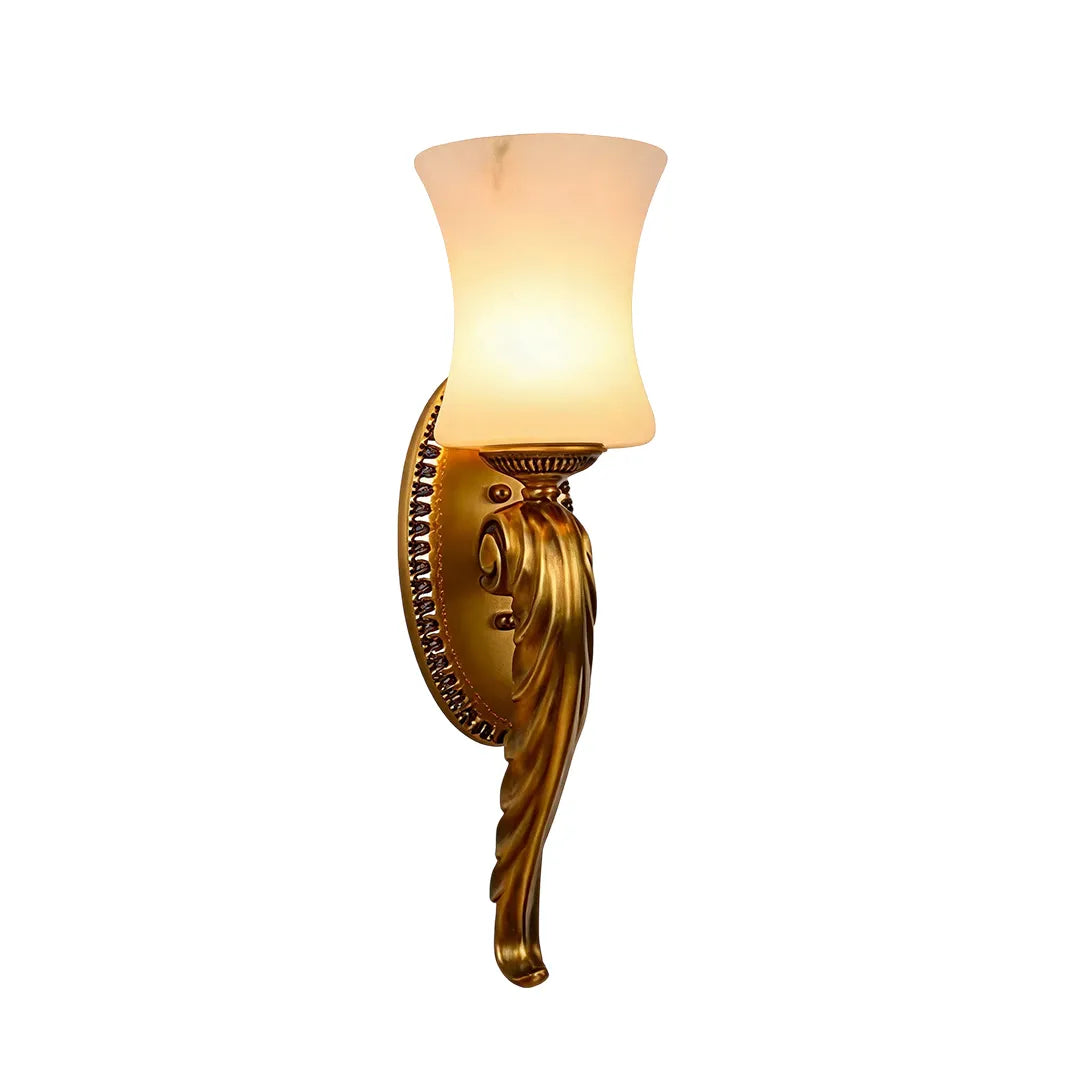 Vintage brass wall sconce product image showing an ornate brass backplate and frosted glass shade.