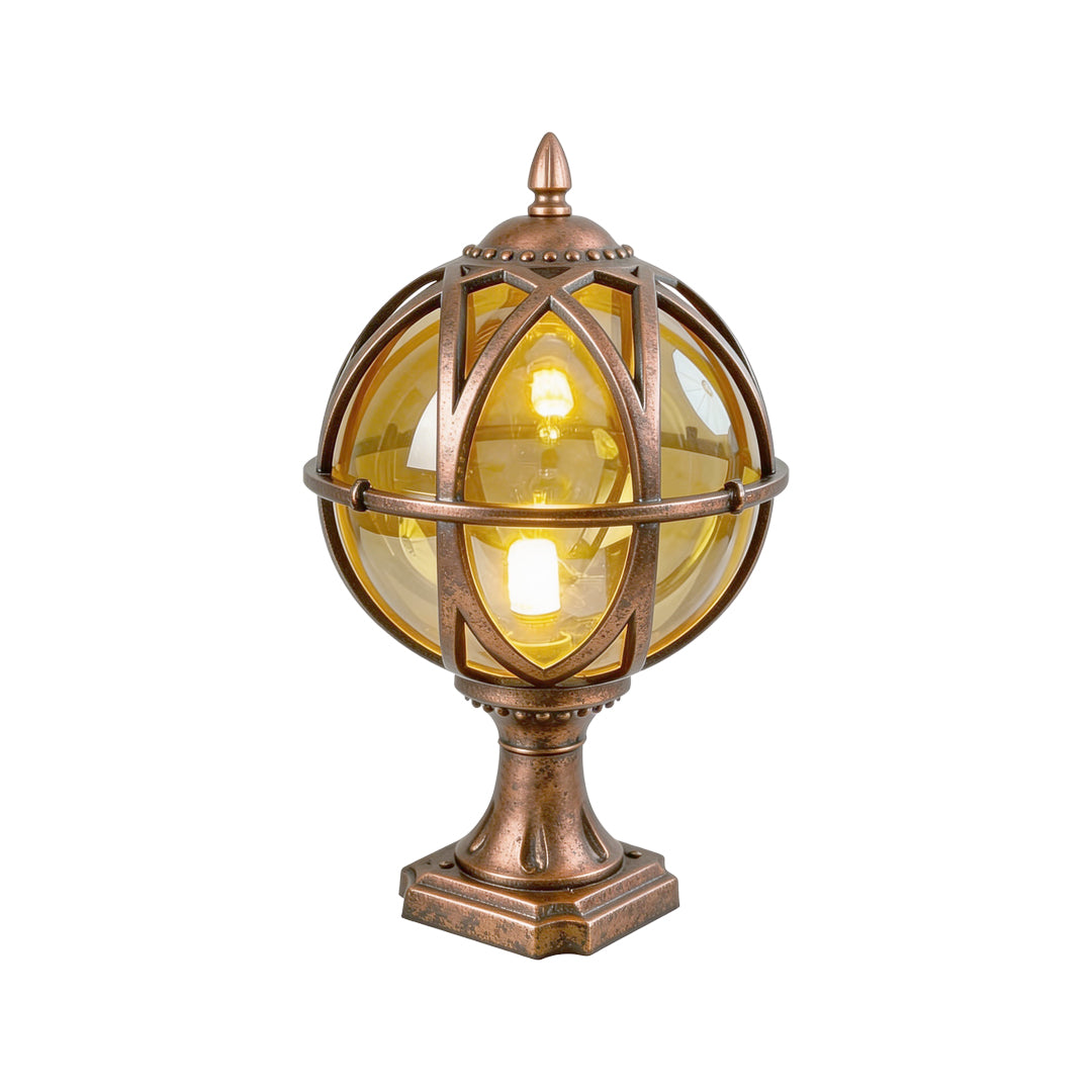 Vintage bronze globe pillar light with a decorative cage and warm glow on a white background ok