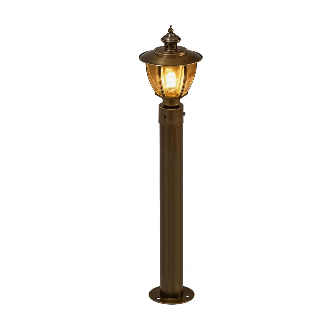 Vintage outdoor pathway light with bronze post and classic lantern design