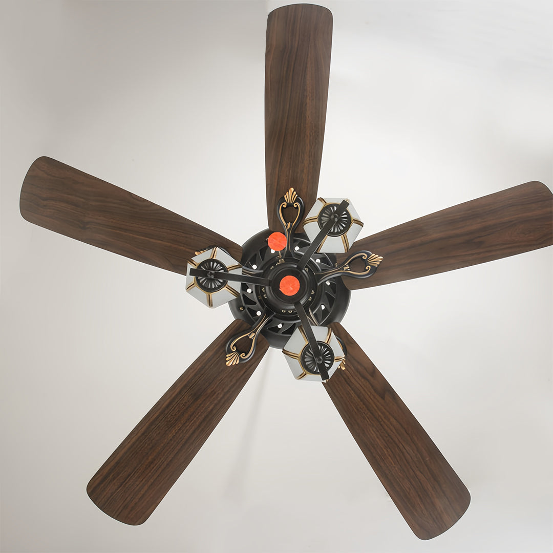 Vintage style ceiling fan with five dark wood blades and black motor housing displayed on white background.