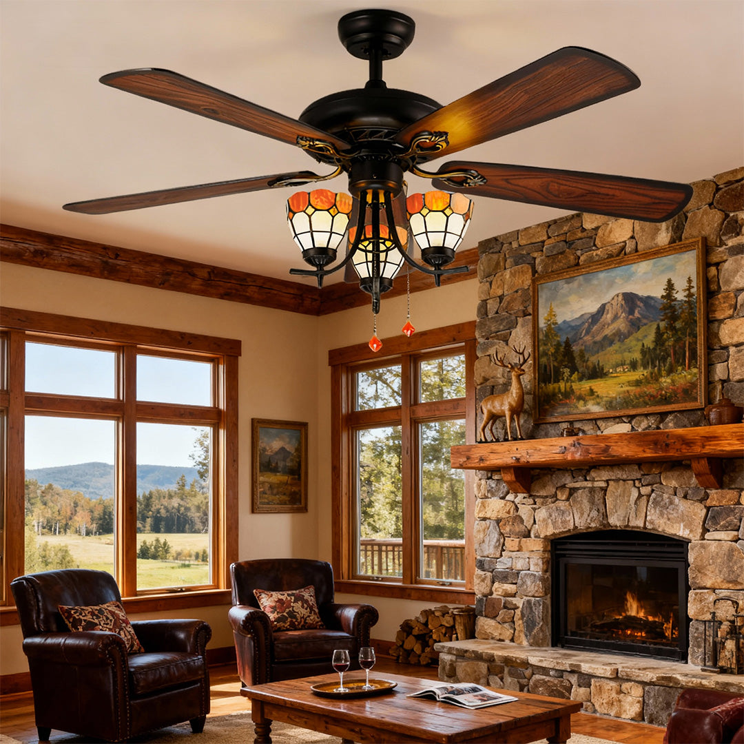 Vintage style ceiling fan with lights brightening rustic family room with stone fireplace and wood furnishings.
