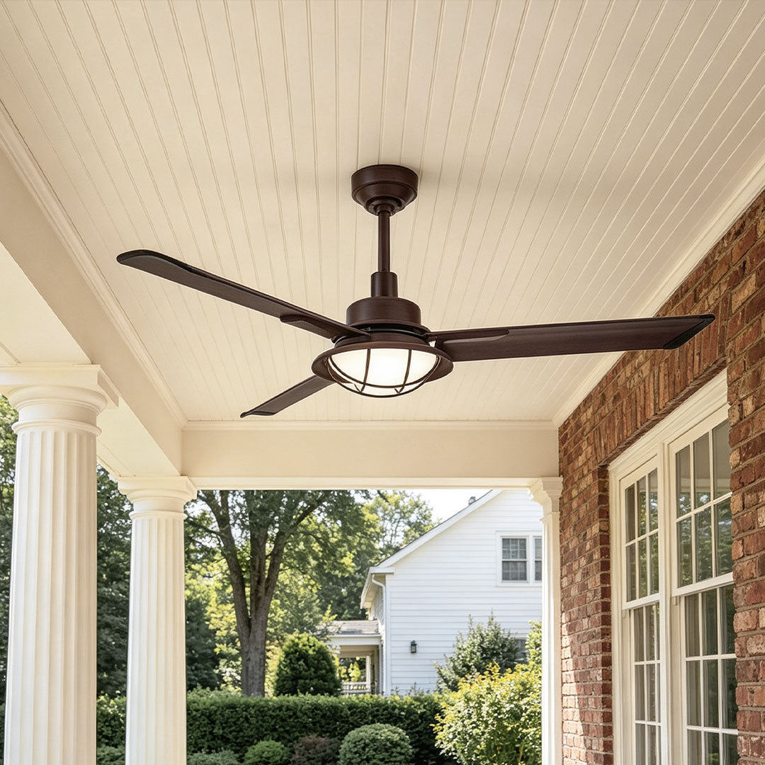 Vintage ceiling fans with lights installed on a covered front porch with brick walls and white columns.