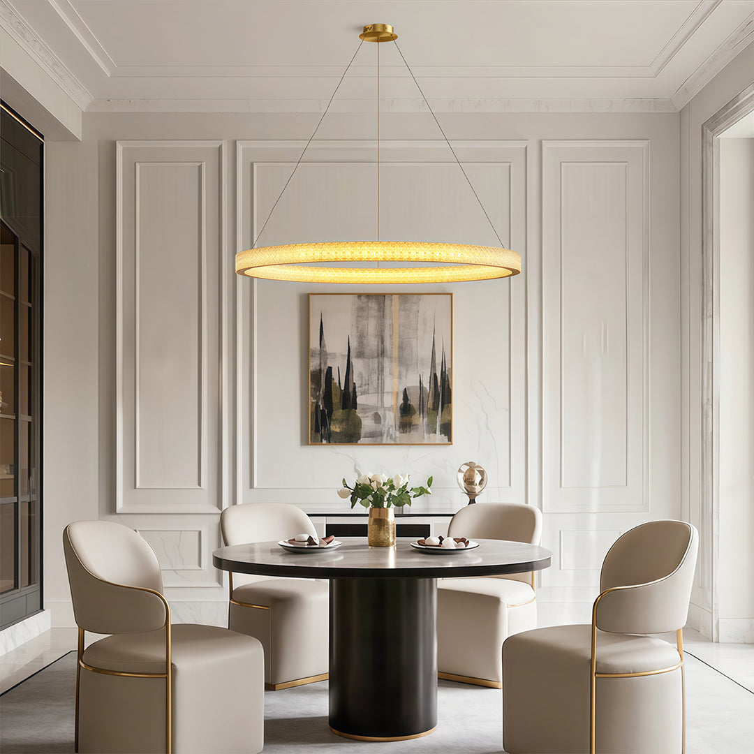 Vintage crystal chandeliers above contemporary dining table with sculptural base