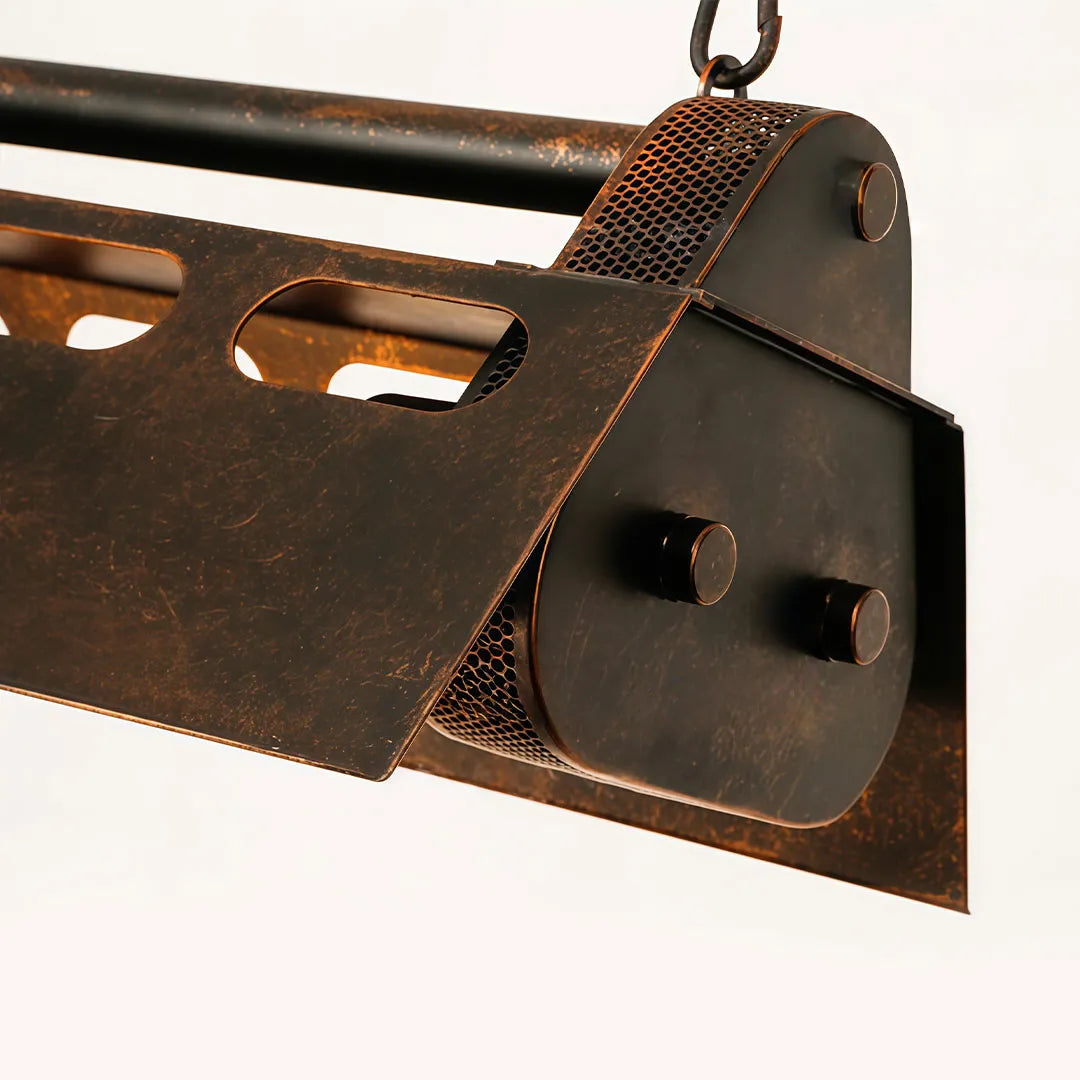 Close-up of vintage farmhouse chandelier showing the chain connection and distressed end plate.