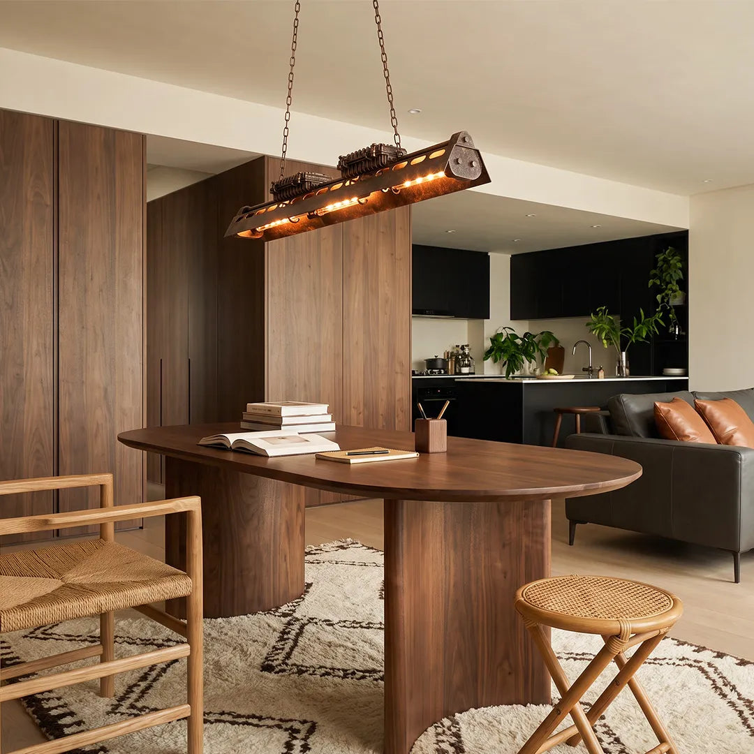 Vintage farmhouse chandelier hanging above a dining area with rustic metal construction.