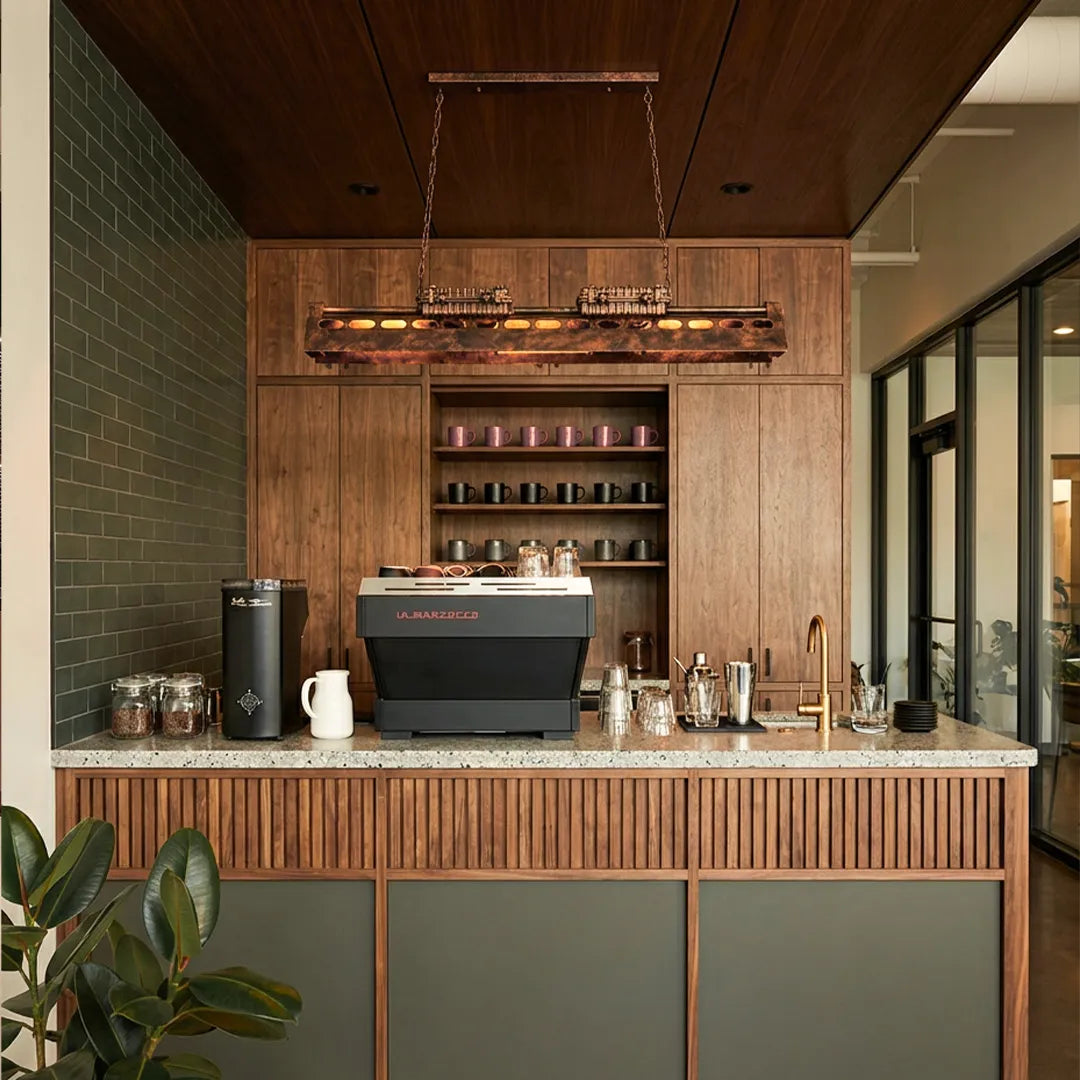 Vintage farmhouse chandelier illuminating a home bar with warm exposed bulbs and chain details.