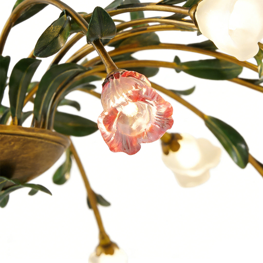 Vintage floral chandelier with a close-up of its floral and leaf structure.