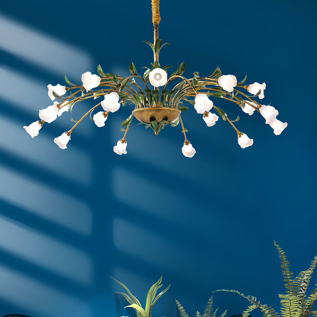 Vintage floral chandelier with colorful blooms illuminating modern bedroom with teal accent wall