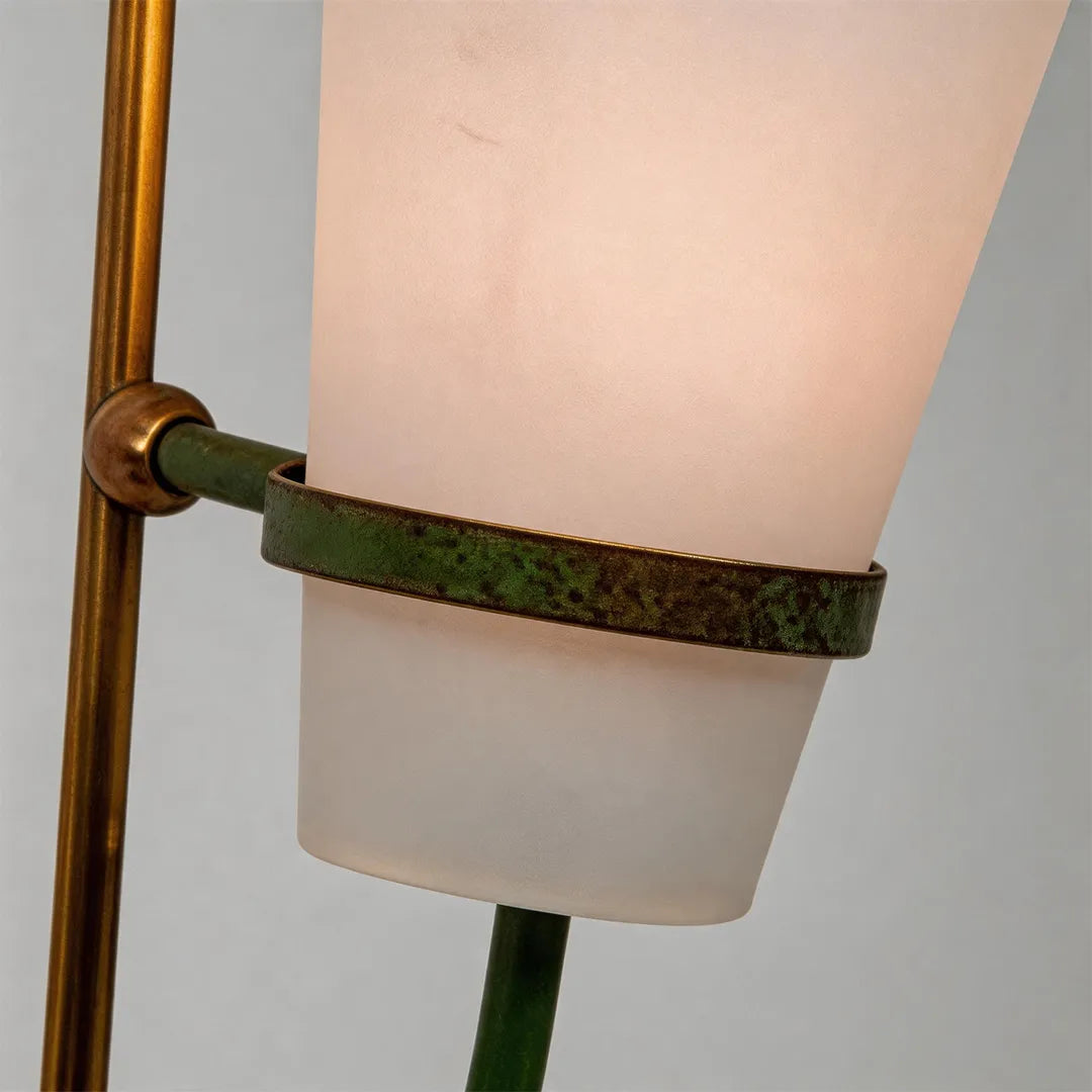 Vintage French wall lights detail showing the frosted glass shade and decorative green accent strap.