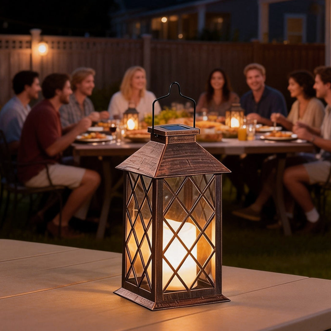 Vintage garden lanterns illuminating an outdoor dining table with warm light.