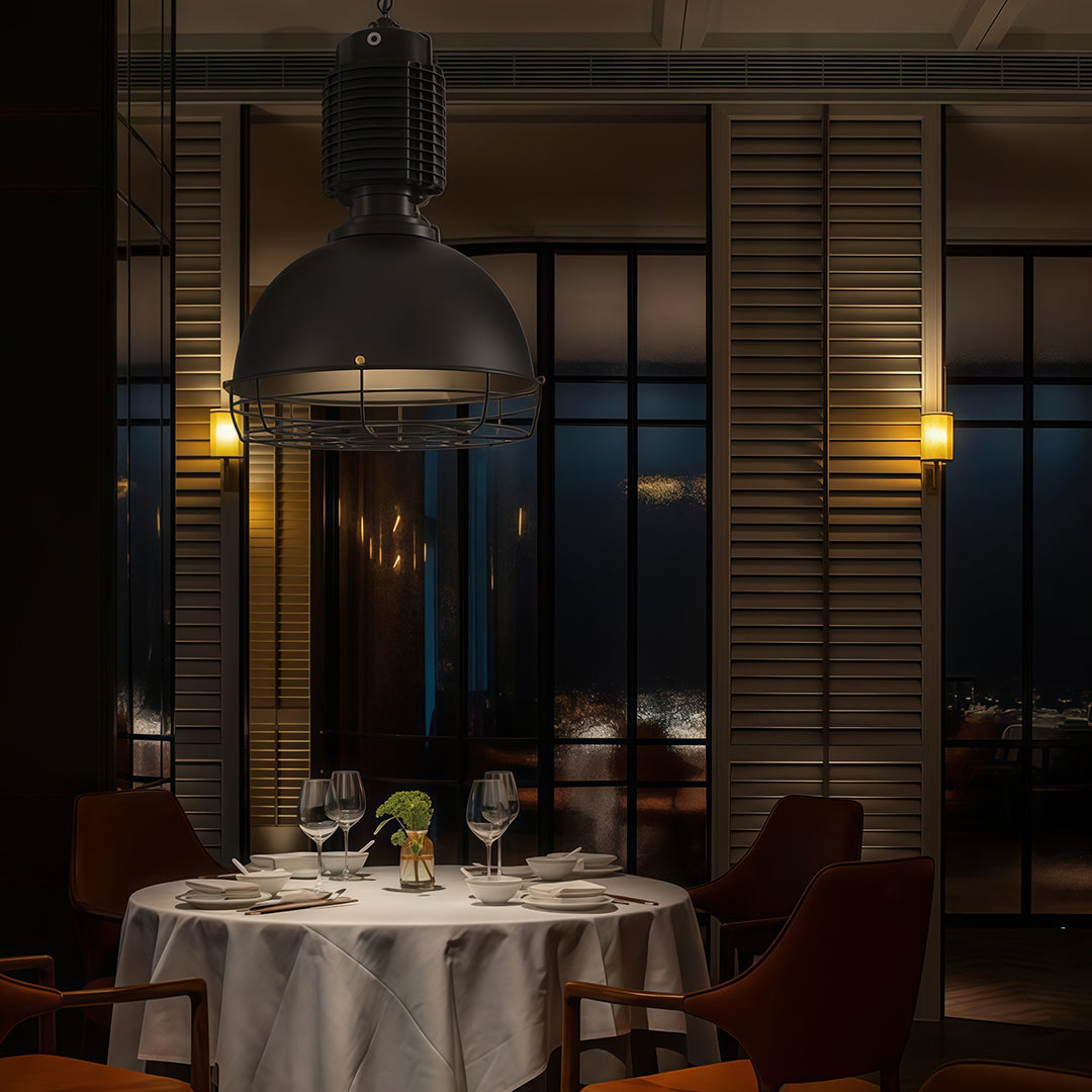 Vintage industrial pendant lighting in upscale restaurant creating intimate atmosphere over elegantly set dining table