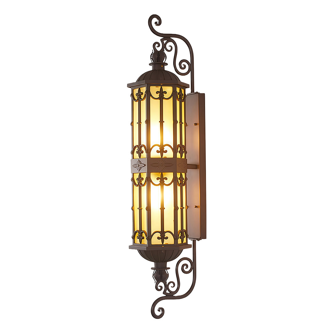 Vintage-inspired LED wall sconce casting a soft glow beside a modern residential exterior.