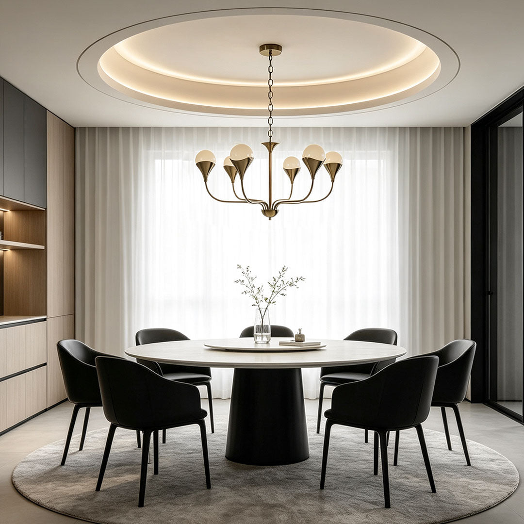 Vintage Italian chandelier centered above a modern dining table beneath a circular recessed ceiling.