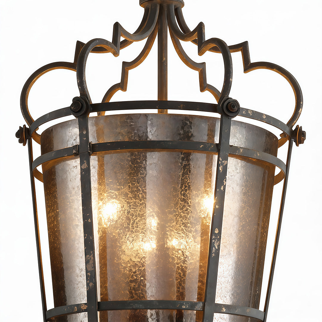 Ornate italian pendant light with vintage bronze frame and frosted glass panels, emitting warm ambient glow.