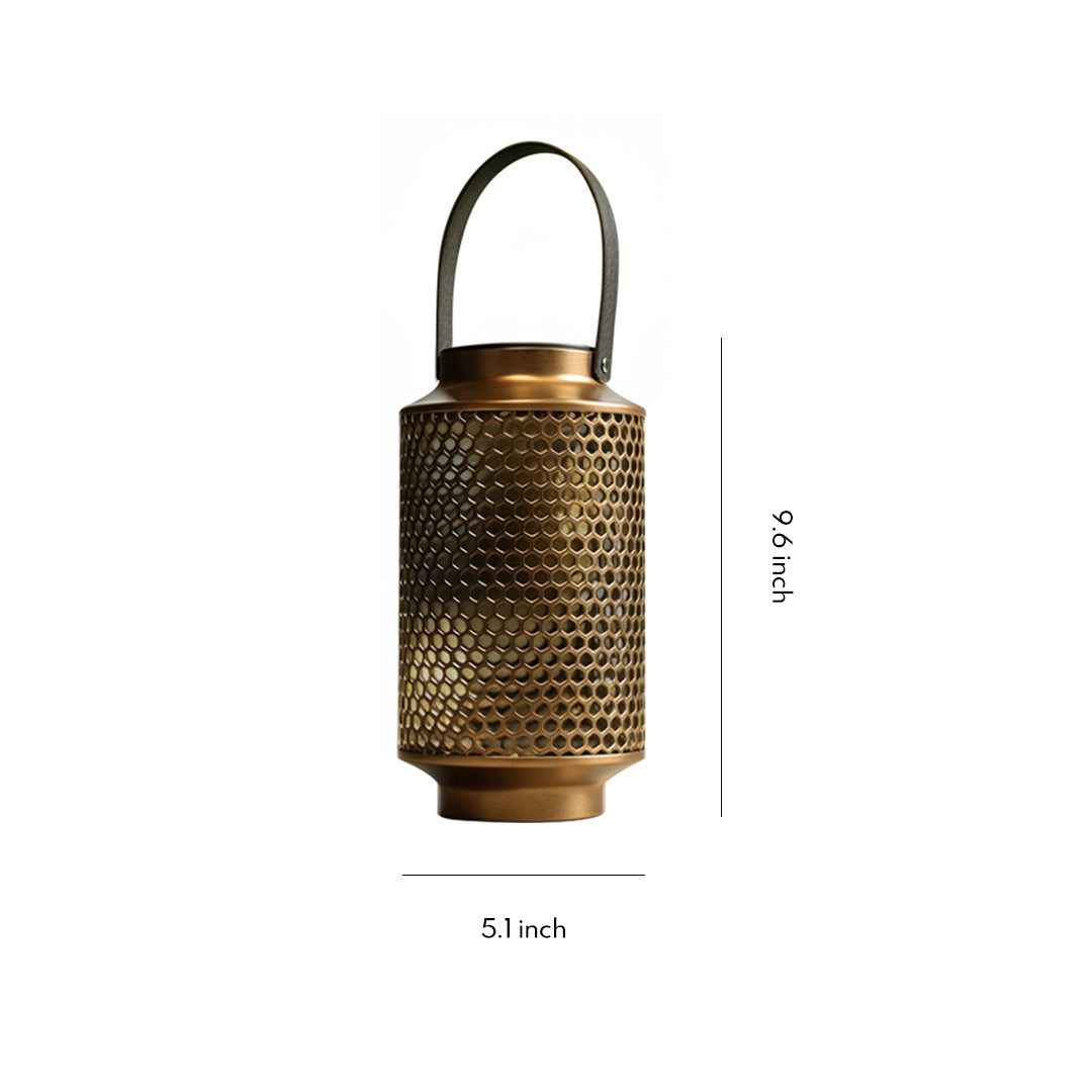 Vintage-style portable solar lantern with perforated metal design against a white background.