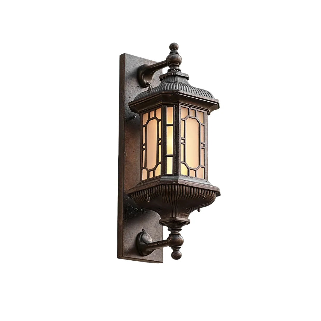 Vintage outdoor wall lantern product image showing a decorative bronze finish and clear glass panels.