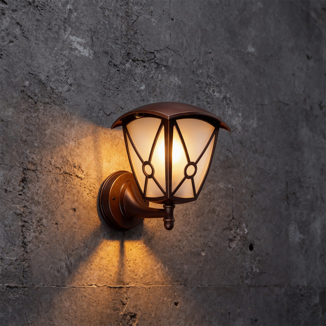 Vintage outdoor wall light for house providing ambient lighting on weathered grey concrete wall