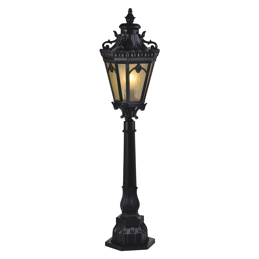 Vintage pathway lighting bollard with amber glass in black finish on white background