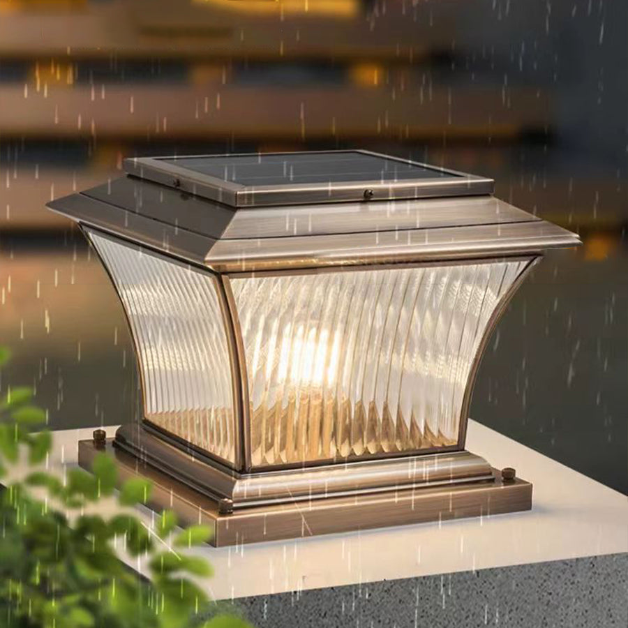 Vintage-style post cap light creating warm ambient lighting in evening garden setting