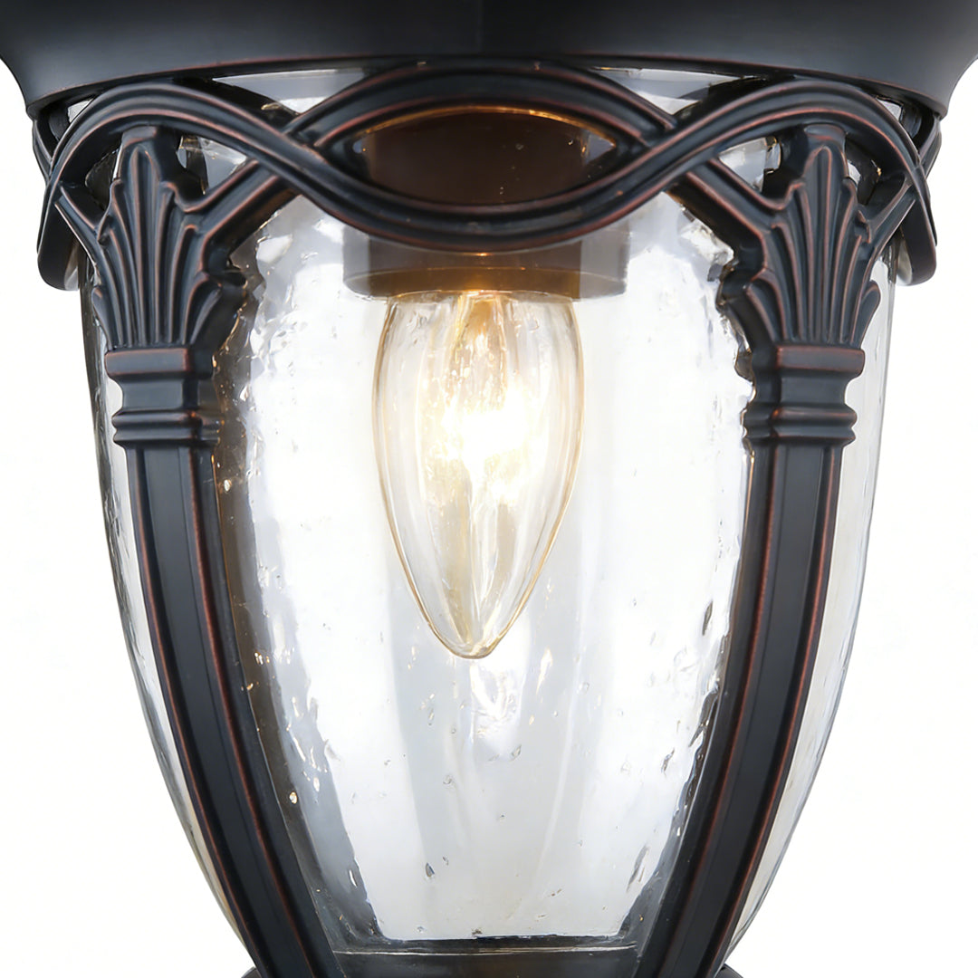 Vintage-style pendant porch light with ribbed glass and ornate black metal frame, perfect for classic front porch illumination.